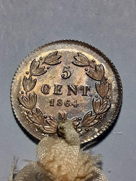 Holed-Mexican-Coin-For-A-Government-Document?
