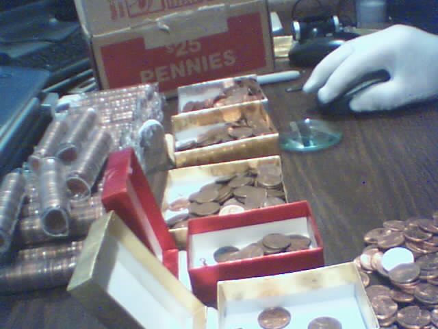 Searching-In-2500-Pennies-50-RollsPictures-Upadated
