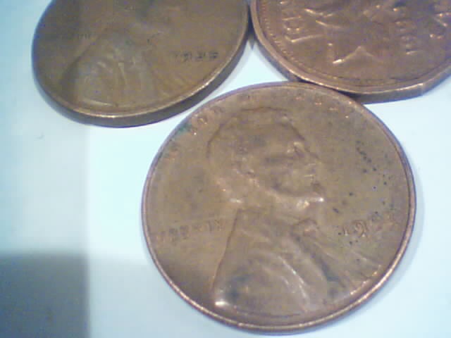 Searching-In-2500-Pennies-50-RollsPictures-Upadated