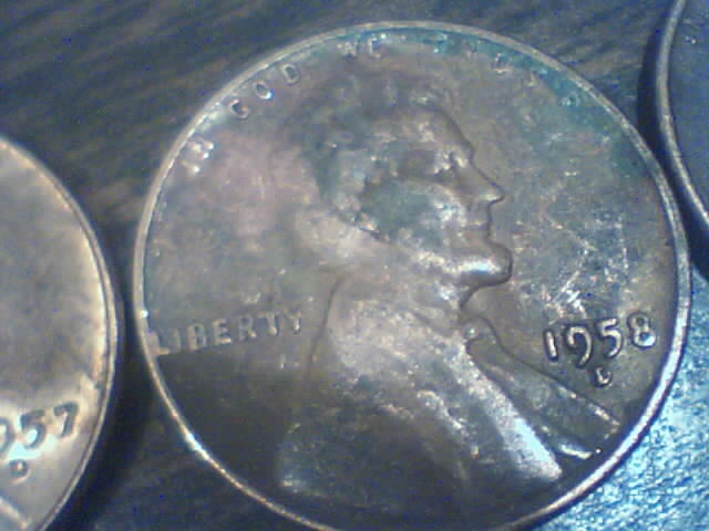 Searching-In-2500-Pennies-50-RollsPictures-Upadated