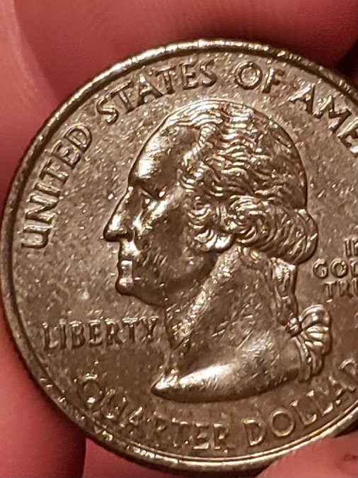 Help,-2005-D-Kansas-Quarter-Odd-Color?
