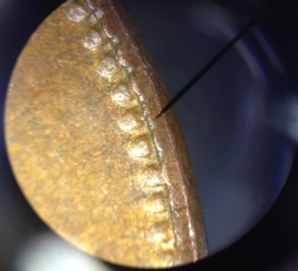 Two-Pennies-That-Are-A-Bit-Odd,-Struck-Through-Grease?