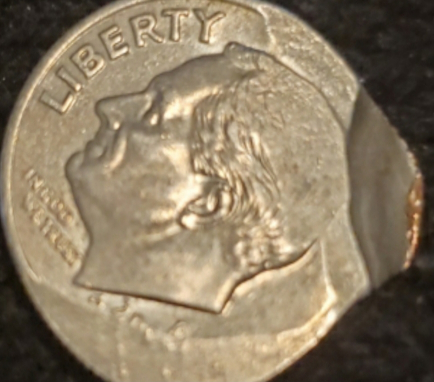 Can-Anyone-Tell-Me-About-This-Strange-Messed-Up-Dime?