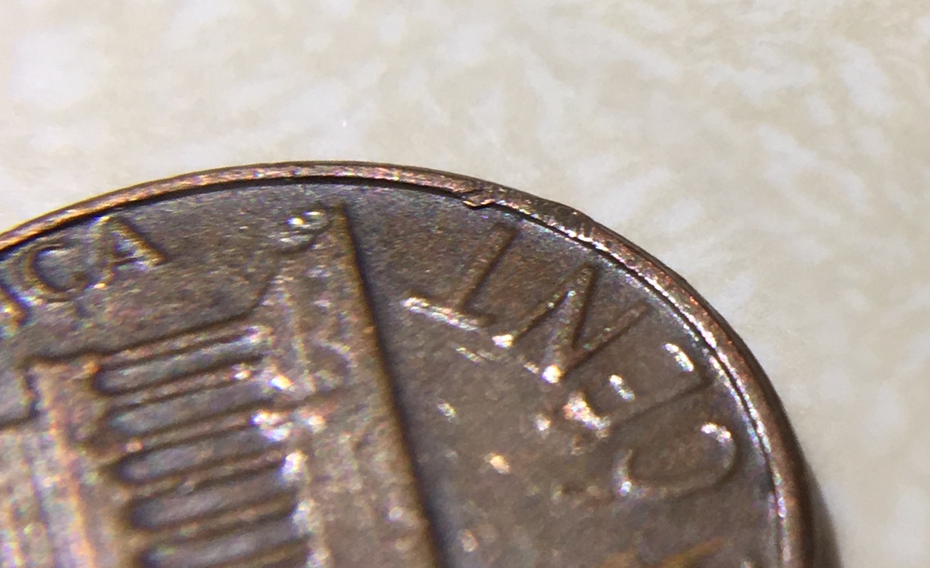 Not-Sure,-Could-Be-Just-Damage,-But-I-See-A-2-On-Lincoln's-Chest