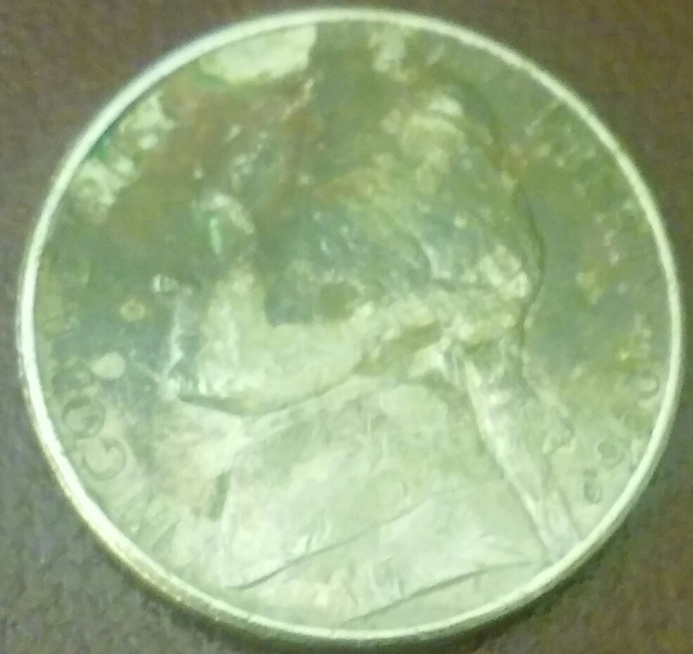 U.-S.-1996-Five-Cents.-Looks-Like-A-Sword-Is-Entering-At-Top-Of-Jefferson's