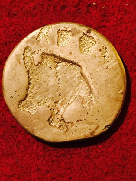 Elephant-Or-Dinosaur-Coin-With-Outline-Of-Earth?