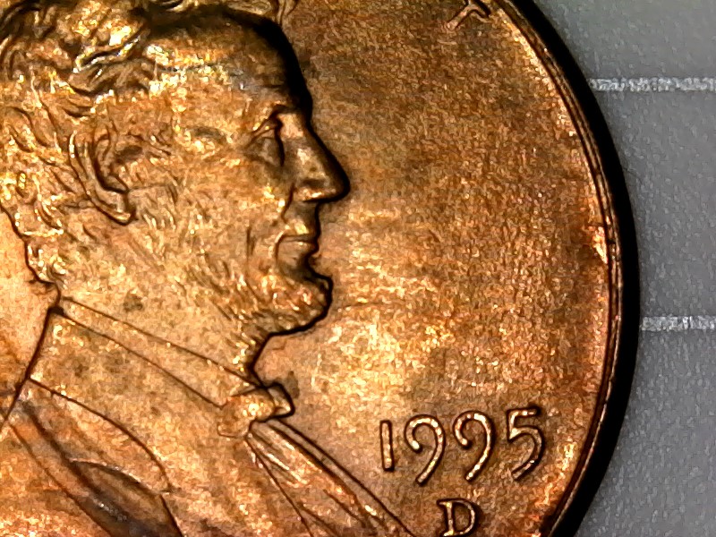 1995-D-Cent-With-Two-Raise-Areas-On-Lower-Jacket-And-Upside-Down-