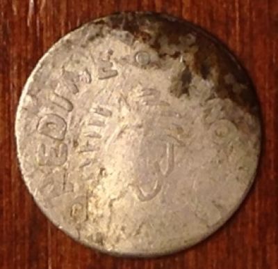 Strange-Dime-Sized-Coin--Play-Money?