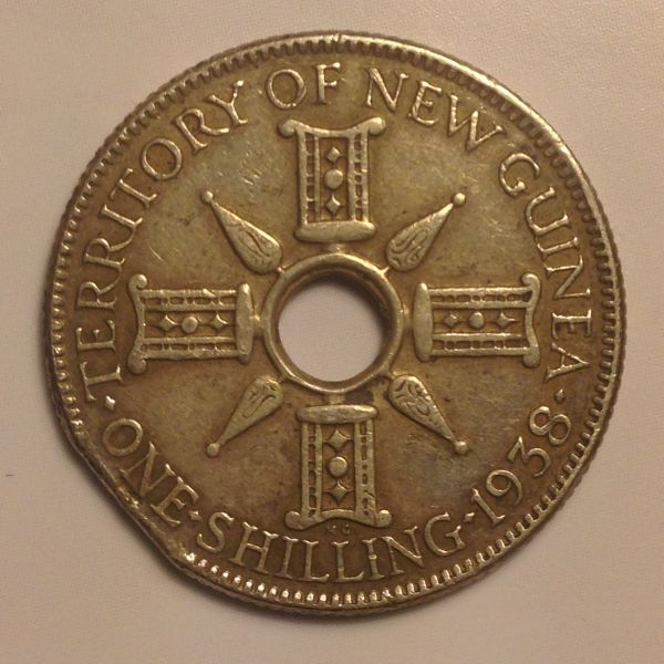 1938-New-Guinea-Shilling-With-Planchet-Clip?
