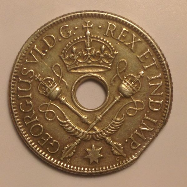 1938-New-Guinea-Shilling-With-Planchet-Clip?
