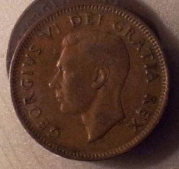 1949-Cent-With-A-Pointing-To-Denticles