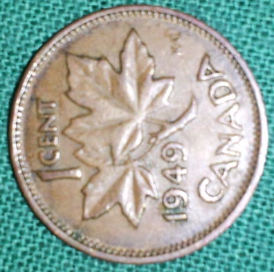1949-Cent-With-A-Pointing-To-Denticles