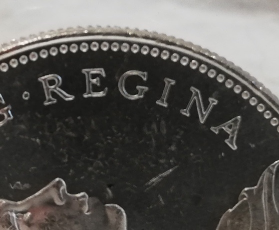 Is-This-A-Small-Bead-1966-Canadian-Dollar?