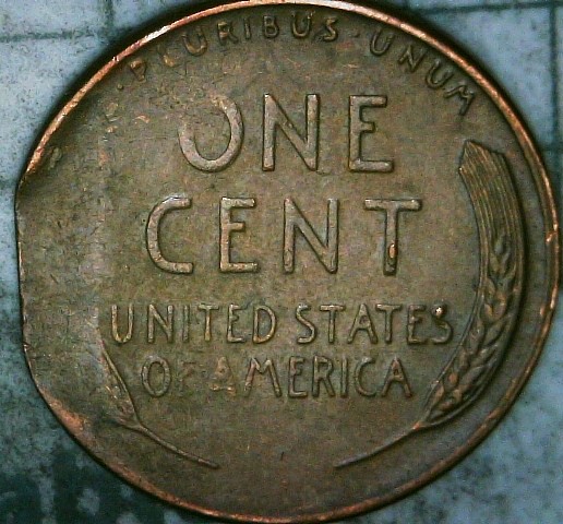 1955-P-Cent-With-A-Straight-Clip-And-Struck-On-A-Tapered-Blank