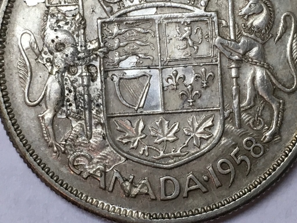1958-Fifty-Cent-Piece-With-Extra-Metal?