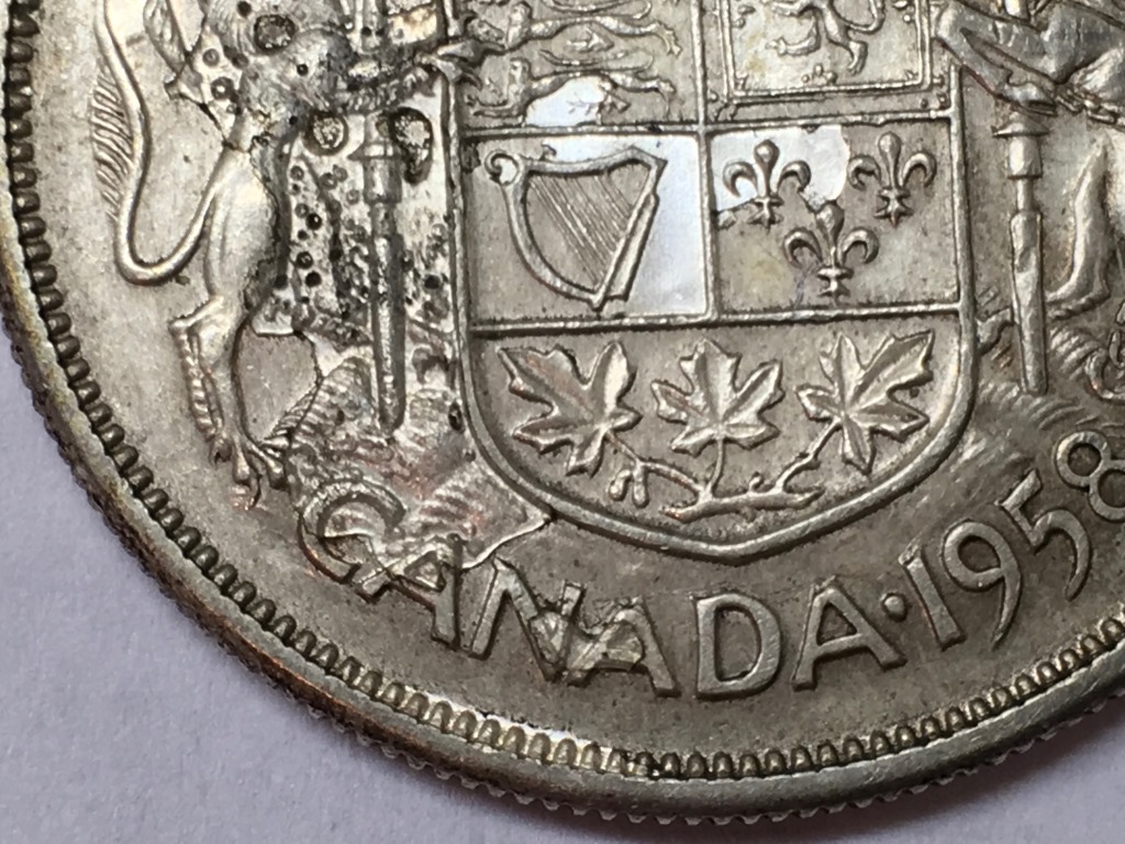 1958-Fifty-Cent-Piece-With-Extra-Metal?