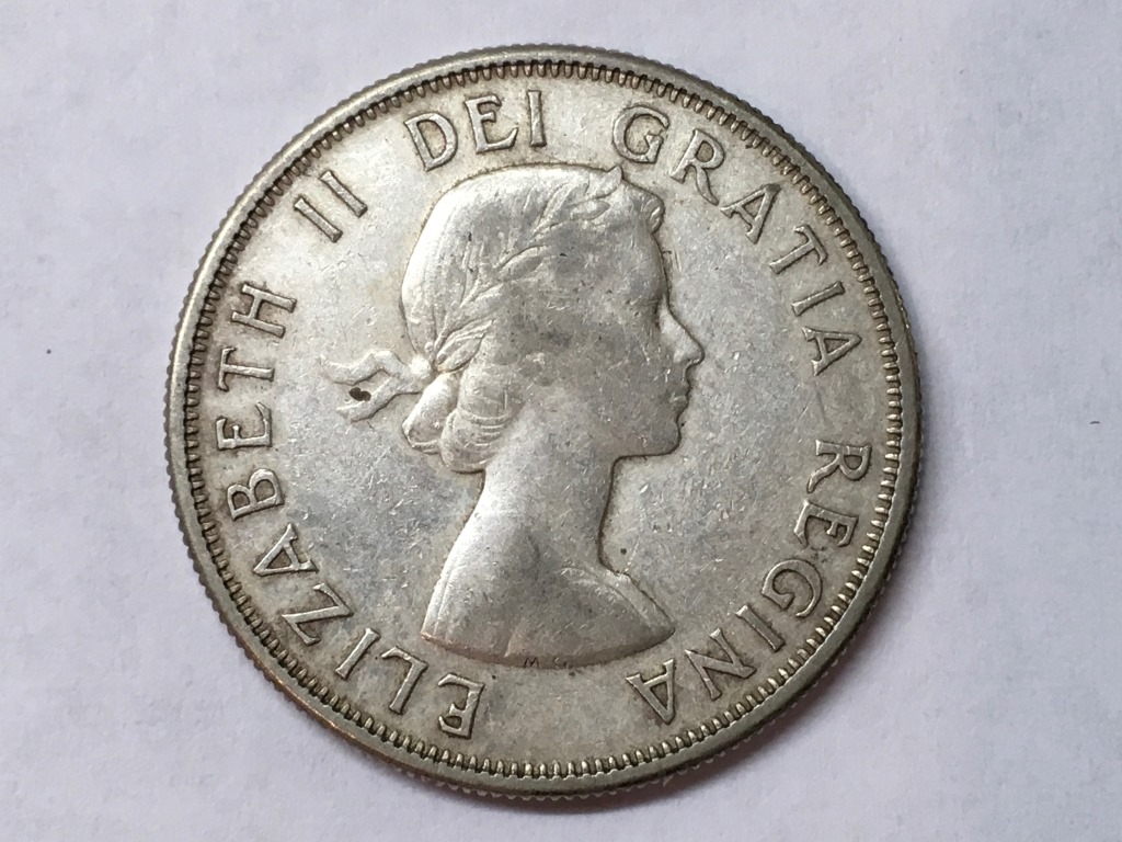 1958-Fifty-Cent-Piece-With-Extra-Metal?