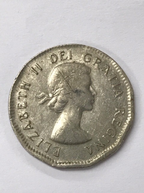 1956-Five-Cent-Coin-Struck-On-A-Foreign-Planchet?