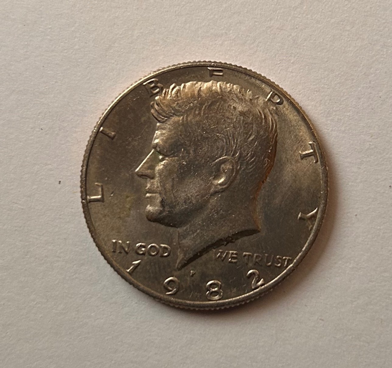 1982-P-Mint-Kennedy-Half-Dollar.-Part-Of-E-Missing-In-Liberty.