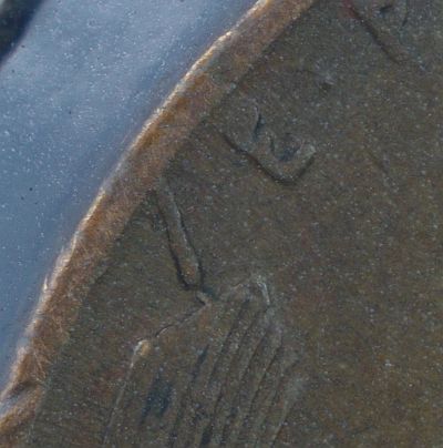 Foreign-Matter-Struck-Onto-Planchet?