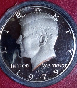 1979-S-Half-Dollar,-Type-1,-Struck-Through-Metal-Shaving-Error-On-Cheek-And-Railroad-Rim-Value