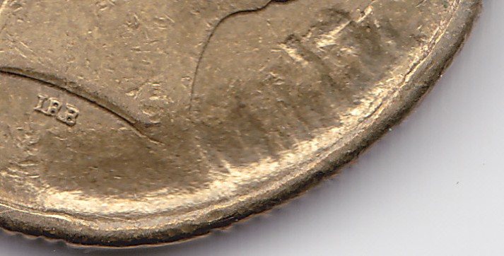 Vandalised-$1-Coin-Number-2?