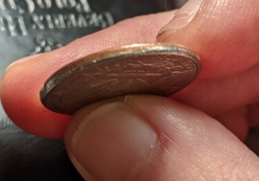 Need-Help-Identifying-If-This-1985-Coin-Is-Damaged-Or-If-It-Is-A-Mint-Error.