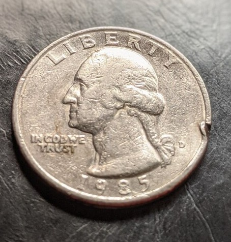 Need-Help-Identifying-If-This-1985-Coin-Is-Damaged-Or-If-It-Is-A-Mint-Error.