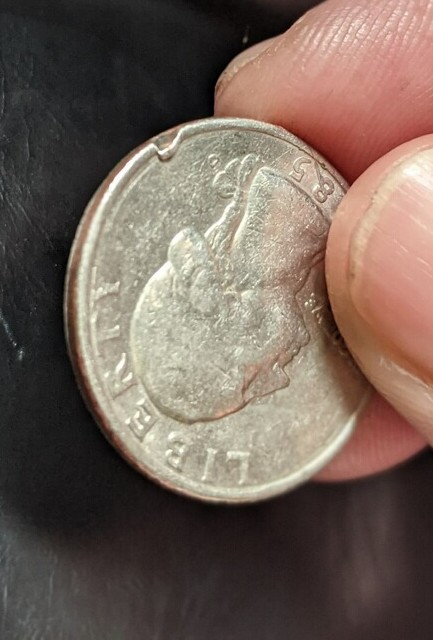 Need-Help-Identifying-If-This-1985-Coin-Is-Damaged-Or-If-It-Is-A-Mint-Error.