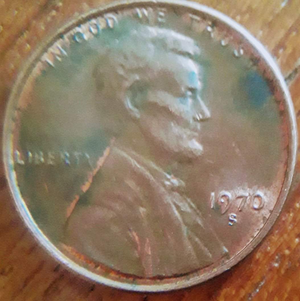 This-Penny-Was-In-The-Jar-Along-With-Many-Other-World-Coins-.