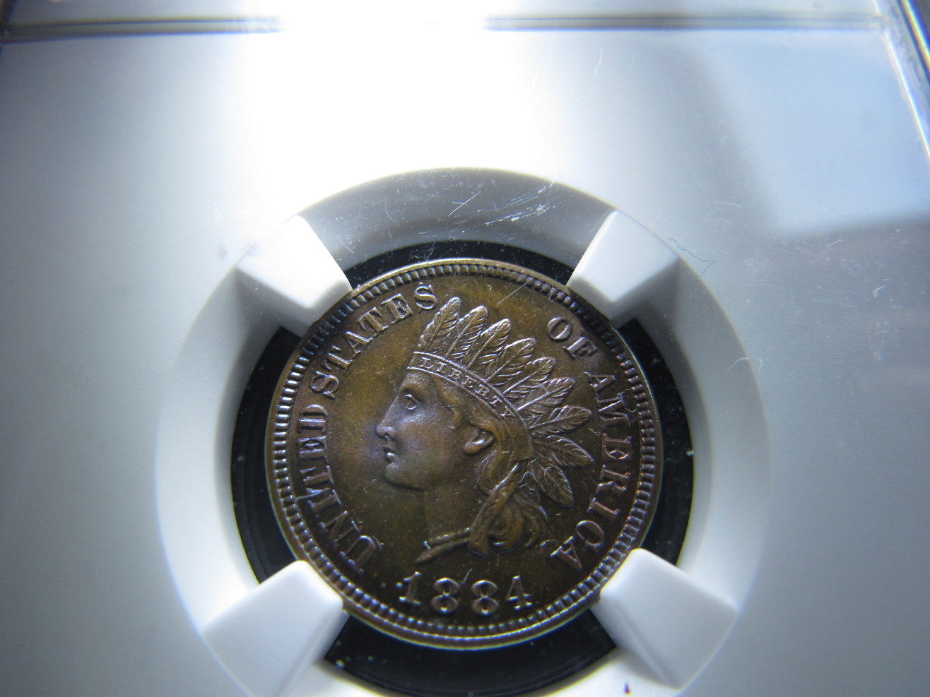 1884-Indian-Cent-PR-65-BN---NGC---Colorful--A-Different-One