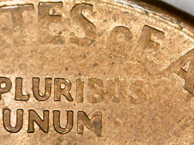 Cent:-Ghost-Letters-Or-Struck-Through-Grease?