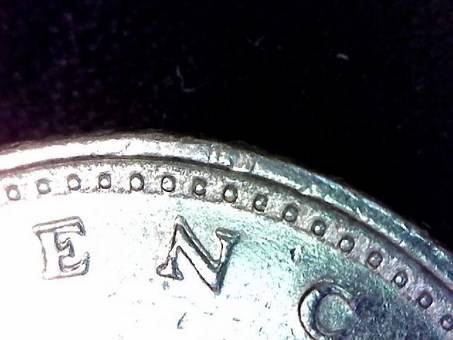 Posting-Pictures-With-Debris-On-Coins