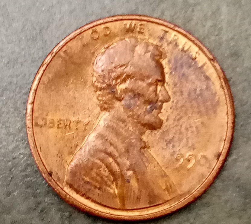 1990?-Penny-Appears-To-Be-Struck-Through-Grease?