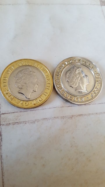 Weird-Looking-�2-Coin/-Fake?