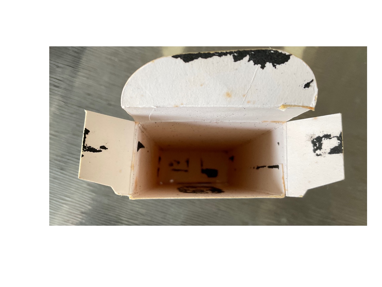 Plastic-Coating-On-Proof-Sets-Stuck-To-Cardboard-Packing