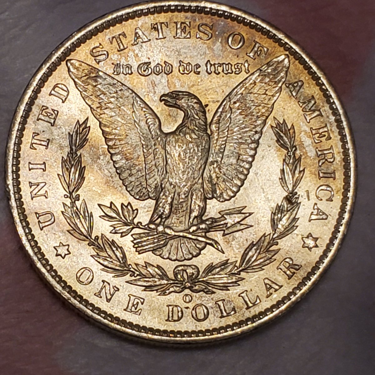1885-O-Morgan-Dollar-Toned.-Any-Idea-Of-Grade-Or-Value?