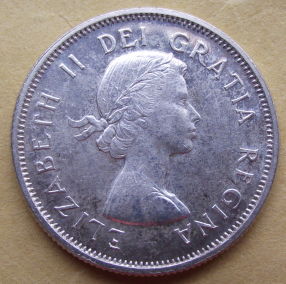 1959-Canadian-Quarter---Double-Strike-And-Dot?