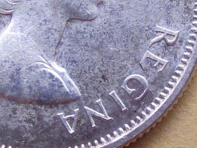 1959-Canadian-Quarter---Double-Strike-And-Dot?
