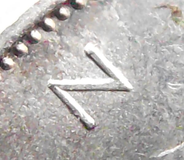 1959-Canadian-Quarter---Double-Strike-And-Dot?