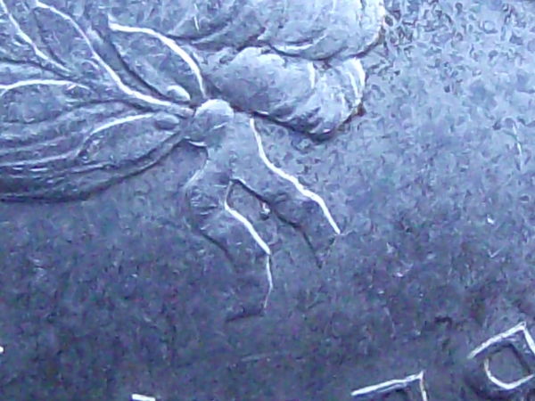 1959-Canadian-Quarter---Double-Strike-And-Dot?