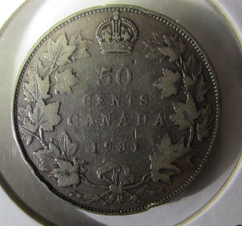 Mint-Error-Above-The-1-In-A-1931-50-Cent-Piece-?
