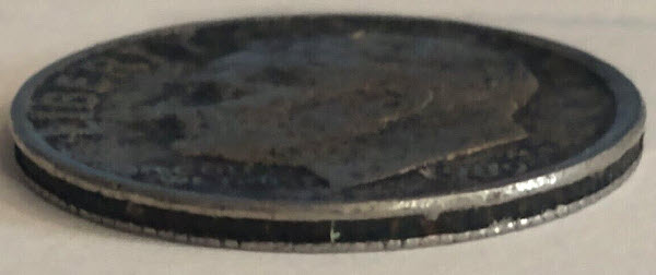 Was-An-Insect-Squished-Inside-This-Dime-When-Is-Was-Struck?-1984-P
