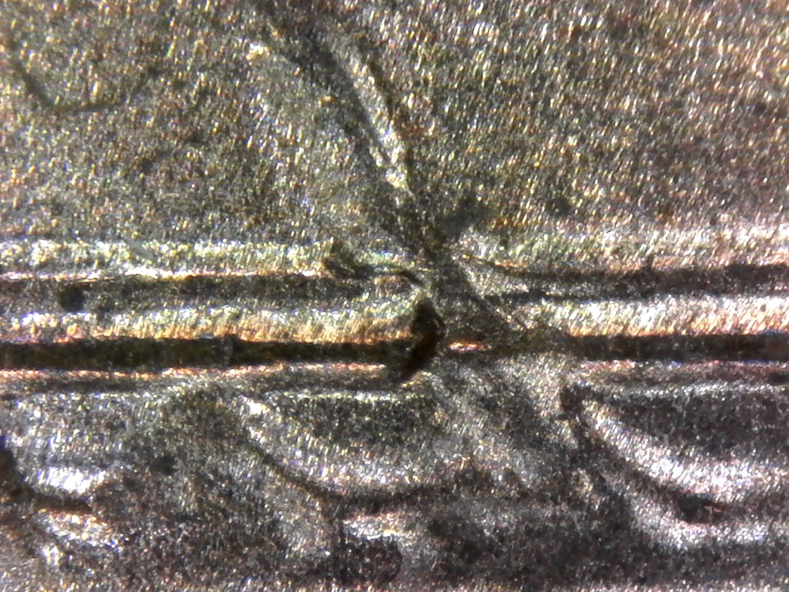 2005-LMC-With-Interesting-Reverse-Defect---Planchet?-Strike-Through?