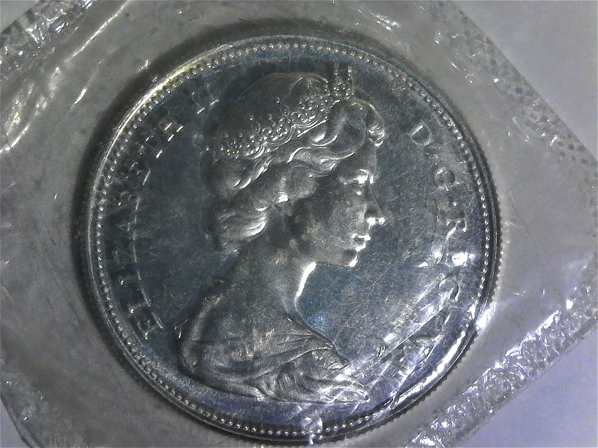 First-Canadian-Coin---1967-$1--Do-I-Leave-It-In-The-Cello?