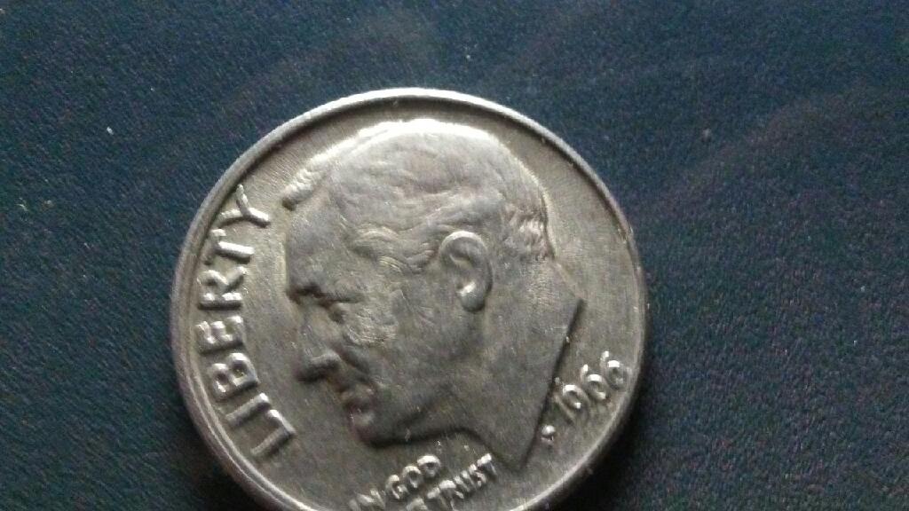 A-Smudge-Embedded-In-Presidents-Cheek-On-This-1966-Dime?
