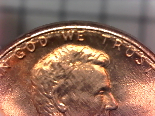 Why-Do-The-Letters-On-This-1987-D-Penny-Look-Like-They-Are-On-An-Inner-Rim?