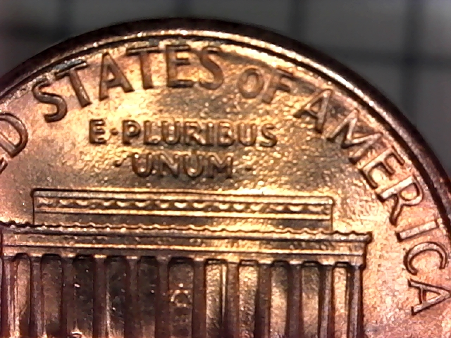 Why-Do-The-Letters-On-This-1987-D-Penny-Look-Like-They-Are-On-An-Inner-Rim?