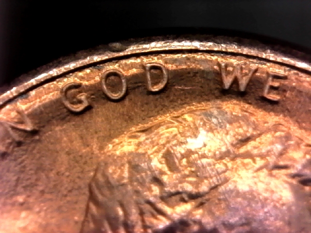 Why-Do-The-Letters-On-This-1987-D-Penny-Look-Like-They-Are-On-An-Inner-Rim?