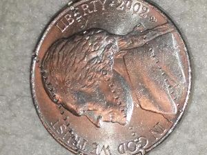 Nickel-With-Dime-Edge-Track-Marks?